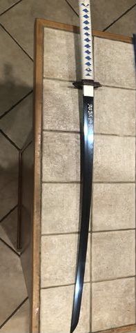 Customer photo review of The Giyuu Tomioka Handmade Katana Clay Tempered T10 Steel From Demon Slayer