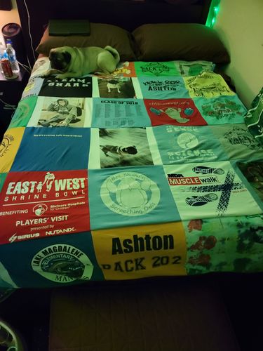 T-shirt quilt with sports, community events themes by Mary from FL