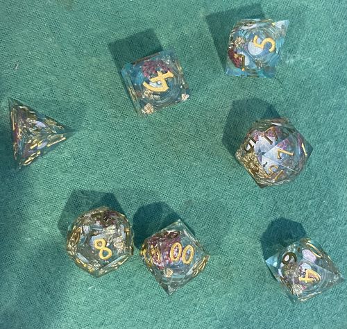 Customer photo review of Blue Red Flower Glitter Liquid Core Resin Moon DnD D&D Dice Set
