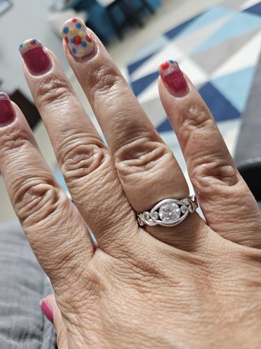 Customer photo review of Bezel Set Round Moissanite Scroll Accents Engagement Ring