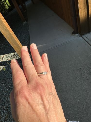 Customer photo review of Solitaire Oval Moissanite Half Bezel Set Engagement Ring