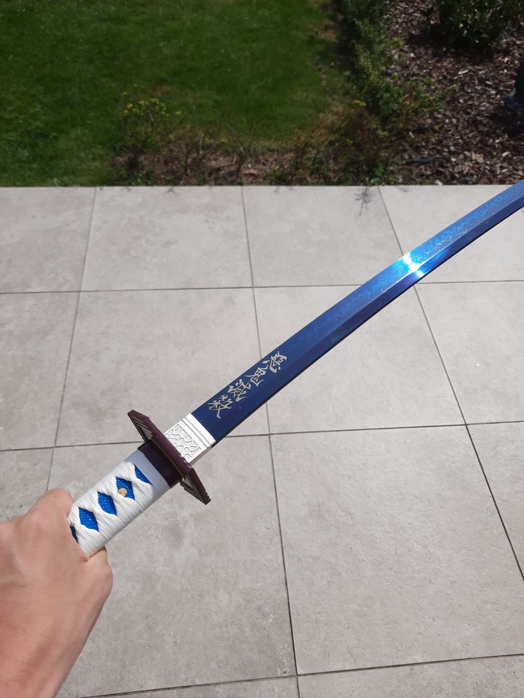 Customer photo review of The Giyuu Tomioka Handmade Katana Clay Tempered T10 Steel From Demon Slayer