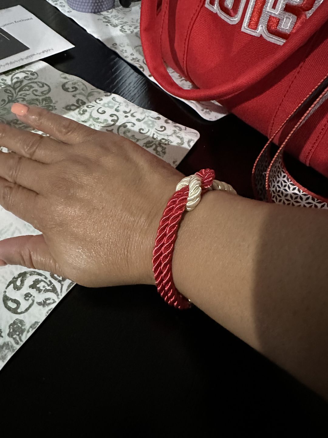 Customer photo review of The Original Love Knot Satin Rope Bracelet- Red and White