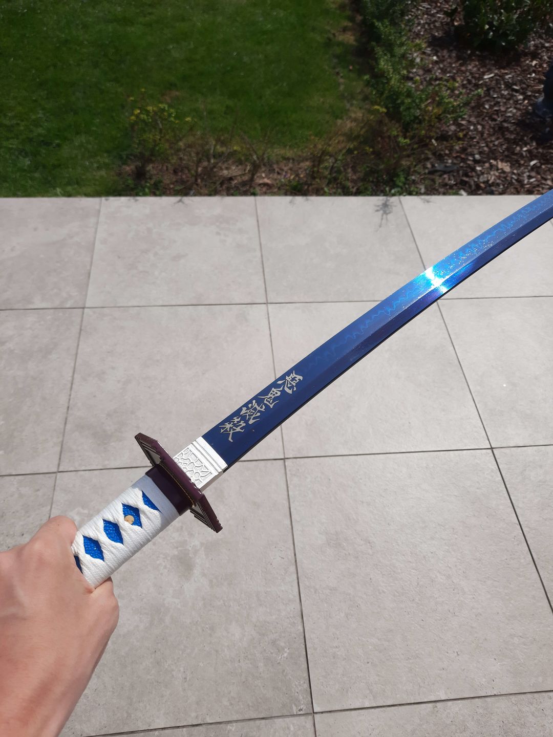 Customer photo review of The Giyuu Tomioka Handmade Katana Clay Tempered T10 Steel From Demon Slayer