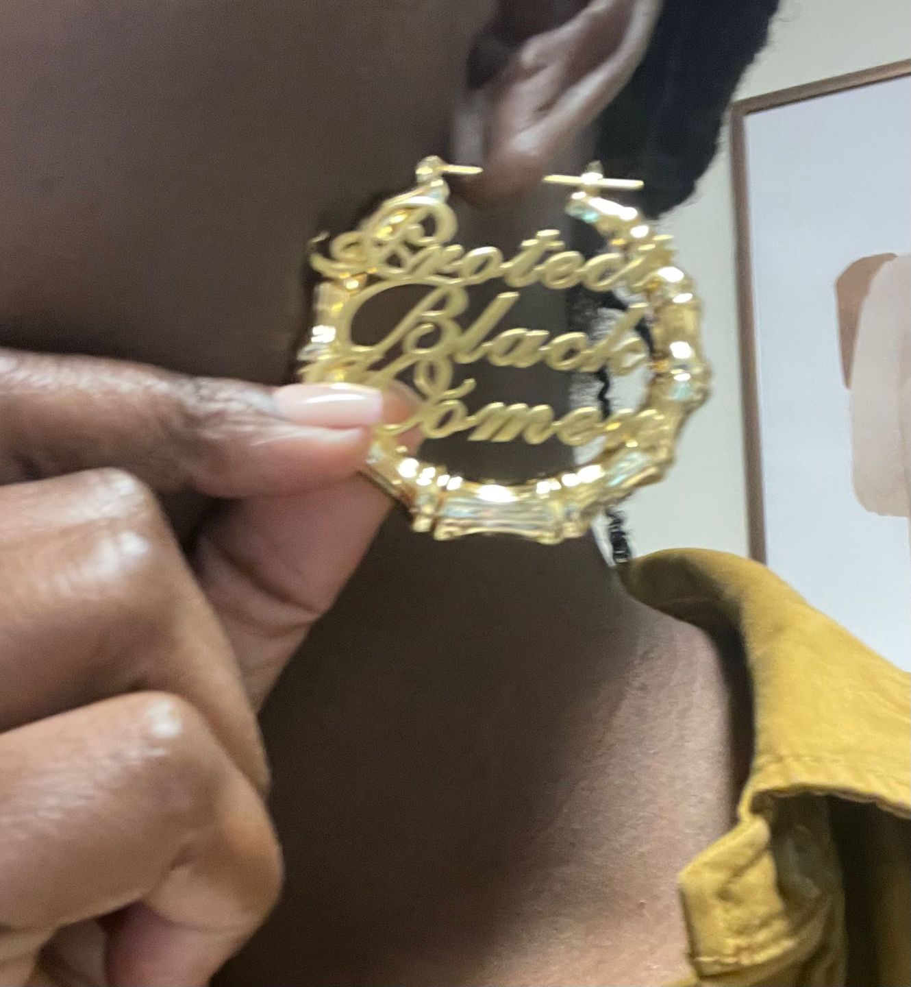 Customer photo review of 18k Gold Plated Protect Black Women Bamboo Hoop Earrings
