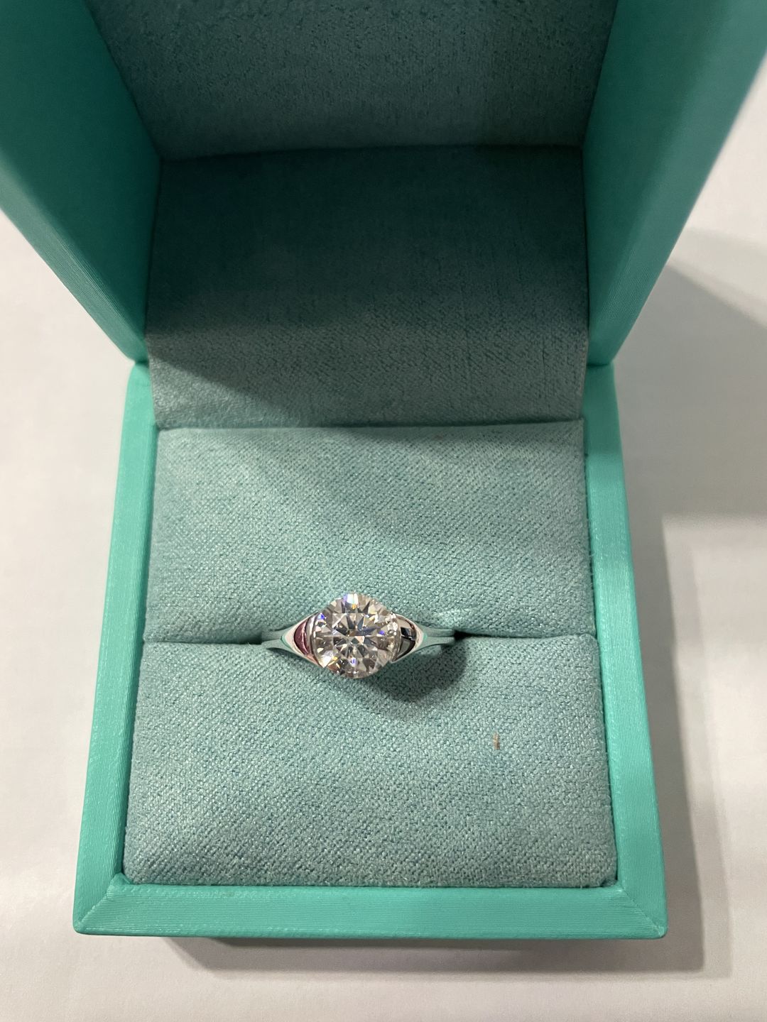 Customer photo review of Alternating Moissanite And Emerald Half Eternity Wedding Band Ring