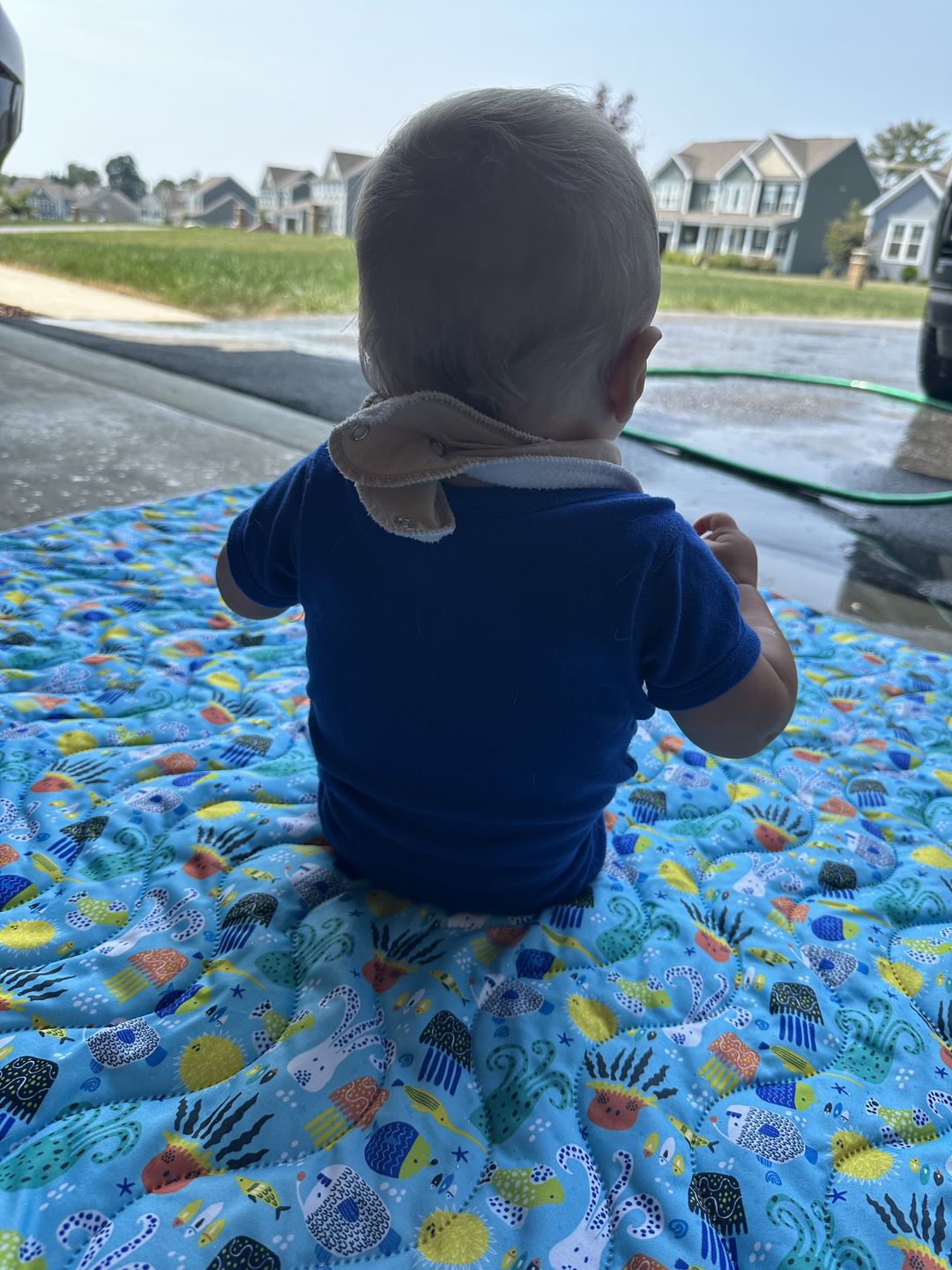 Customer photo review of Basics Patterned Machine Washable Reversible Indoor/Outdoor Quilted Water Resistant Play Mat Blanket