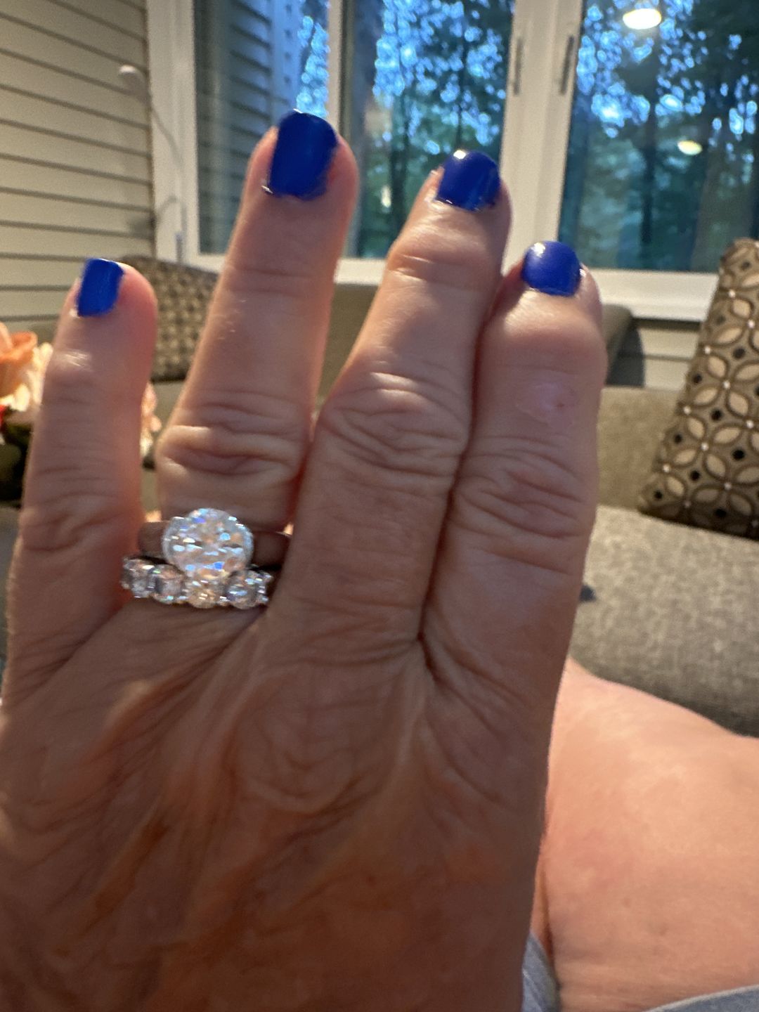 Customer photo review of Solitaire Moissanite Half Bezel Set Sterling Silver Engagement Ring