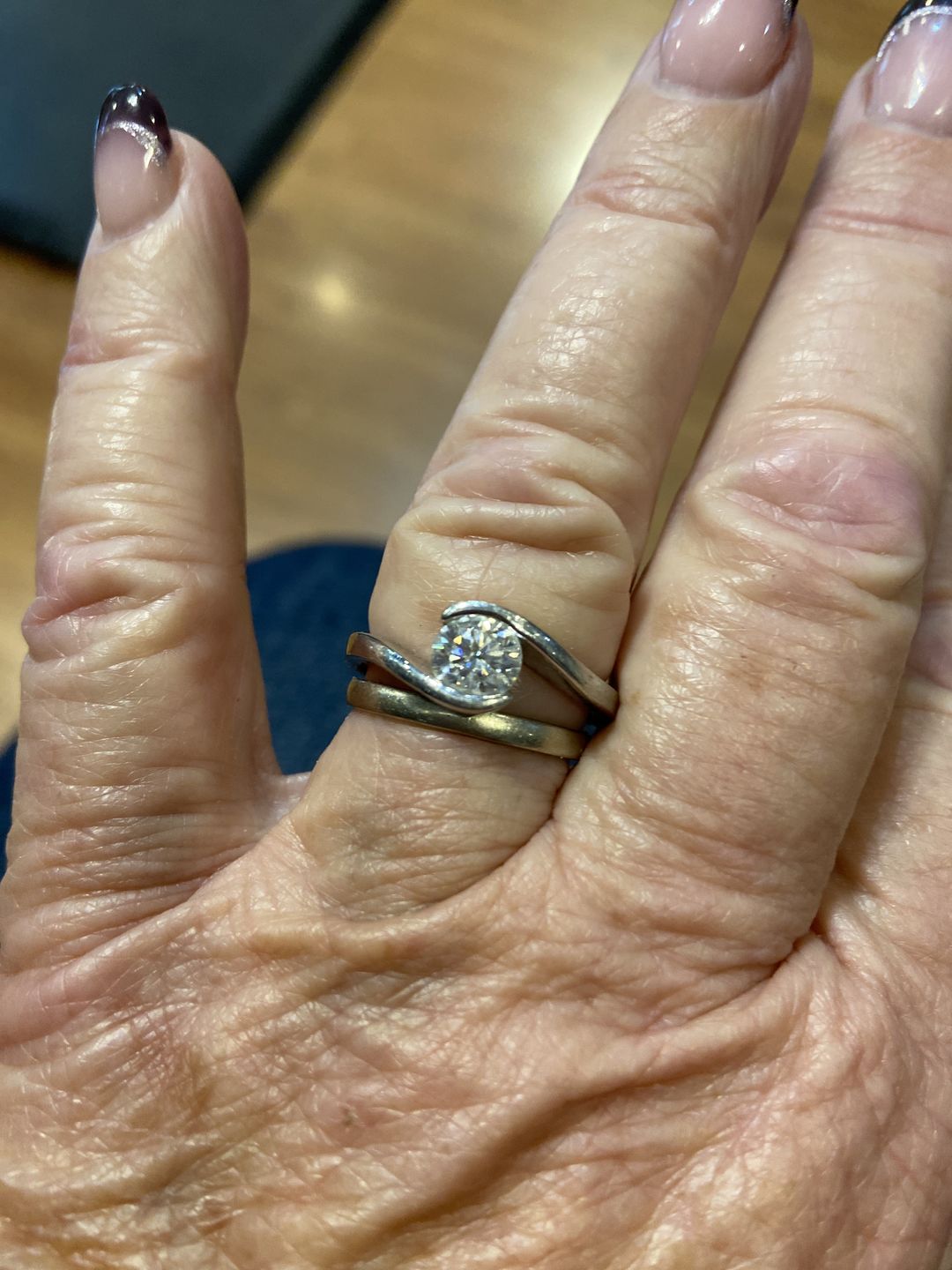 Customer photo review of Solitaire Tension Set Moissanite Bypass Engagement Ring