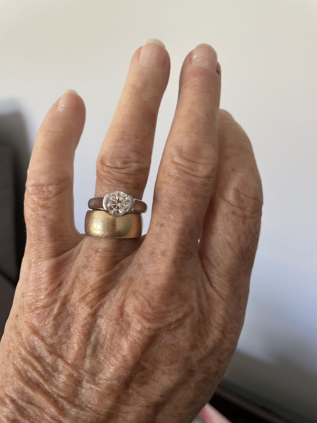 Customer photo review of Solitaire Moissanite Half Bezel Set Sterling Silver Engagement Ring