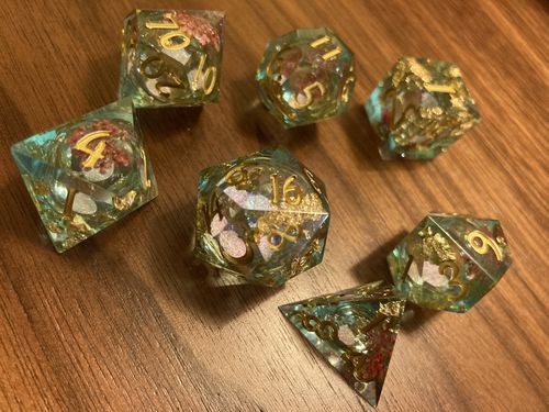 Customer photo review of Blue Red Flower Glitter Liquid Core Resin Moon DnD D&D Dice Set