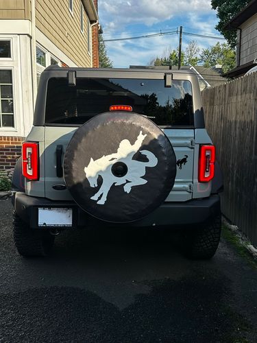 Customer photo review of Bigfoot Sasquatch Riding a Bronco Spare Tire Cover Design