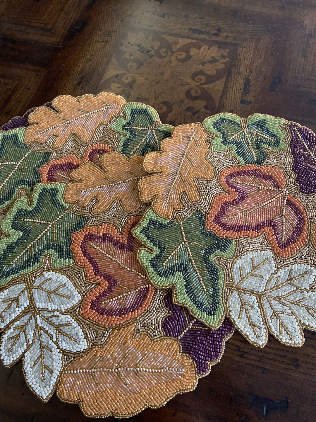 Customer photo review of Autumnal Bead Embroidered PlacematColor: Orange, Green, Natural, Gold Size: 14" RoundSet of 2/4