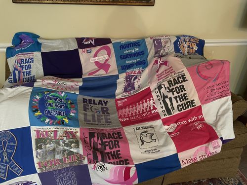 T-shirt quilt with cancer awareness, community support themes by Mary Helen from GA