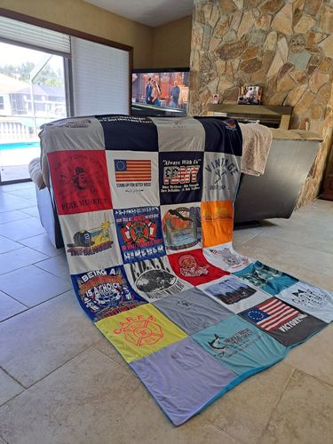 T-shirt quilt with firefighting, community service themes by Melissa from NY