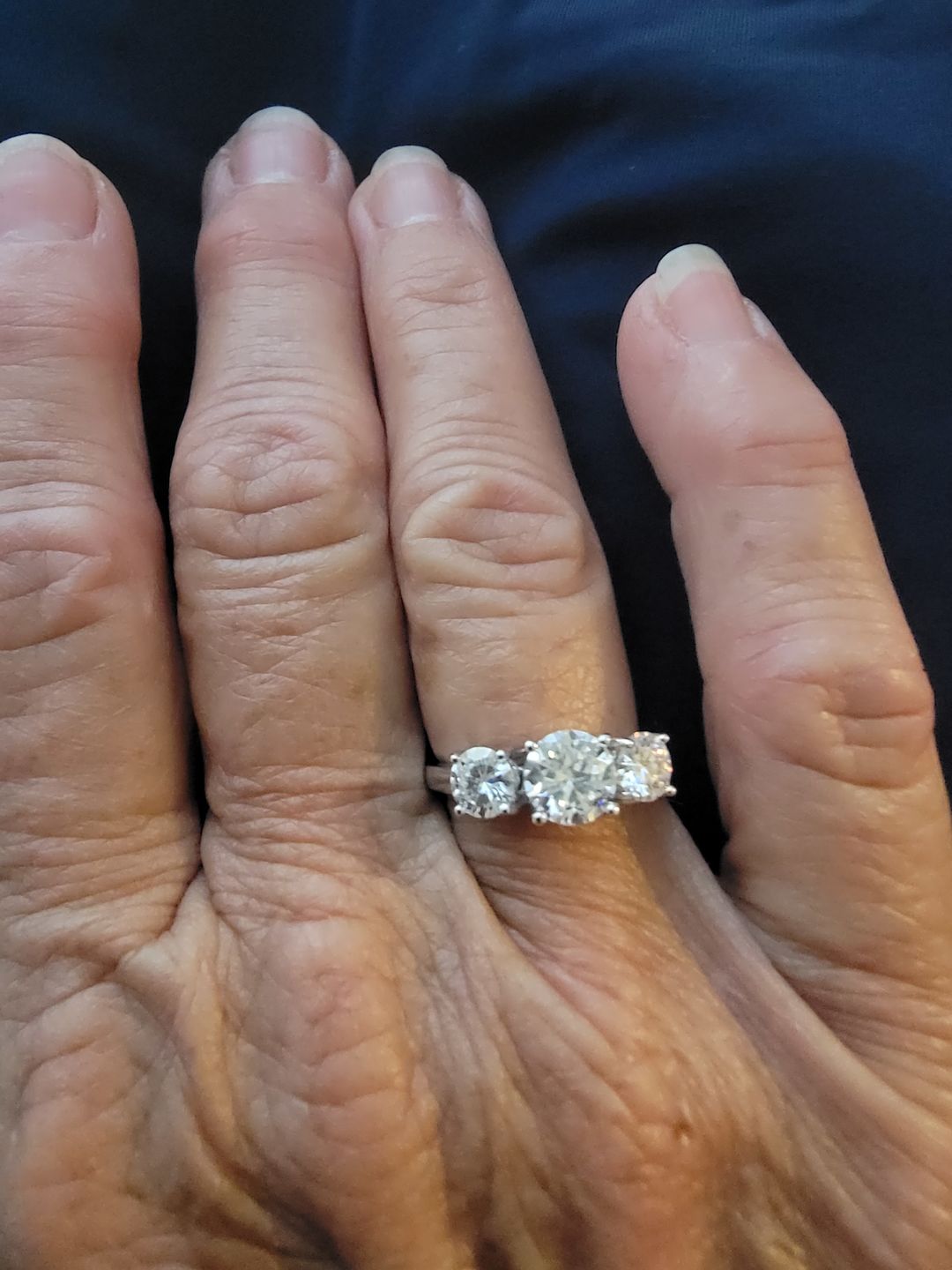 Customer photo review of Classic Three Stone Round Cut Moissanite Sterling Silver Wedding Ring