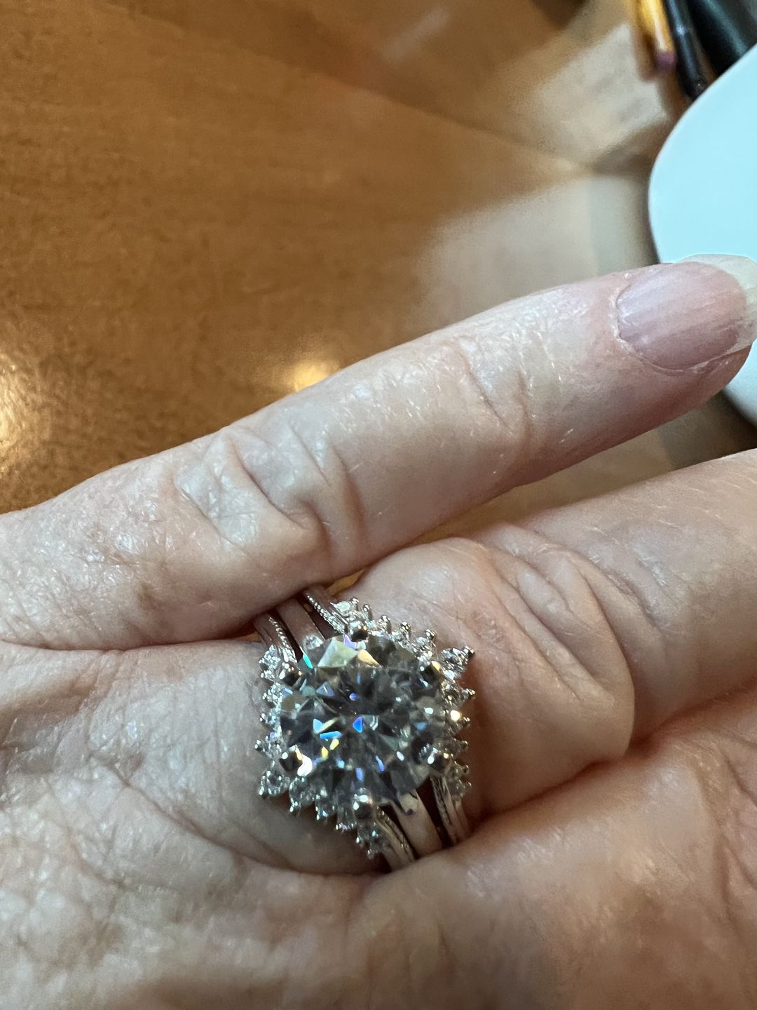 Customer photo review of Solitaire Moissanite With Enhancer Shank Bridal Engagement Ring Set
