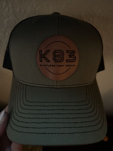 Customer photo review of Custom Leather Patch Trucker Hat - Richardson 112