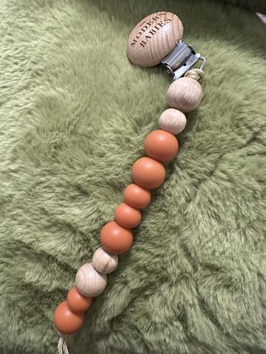 Customer photo review of Pacifier Clip (Clay Orange)