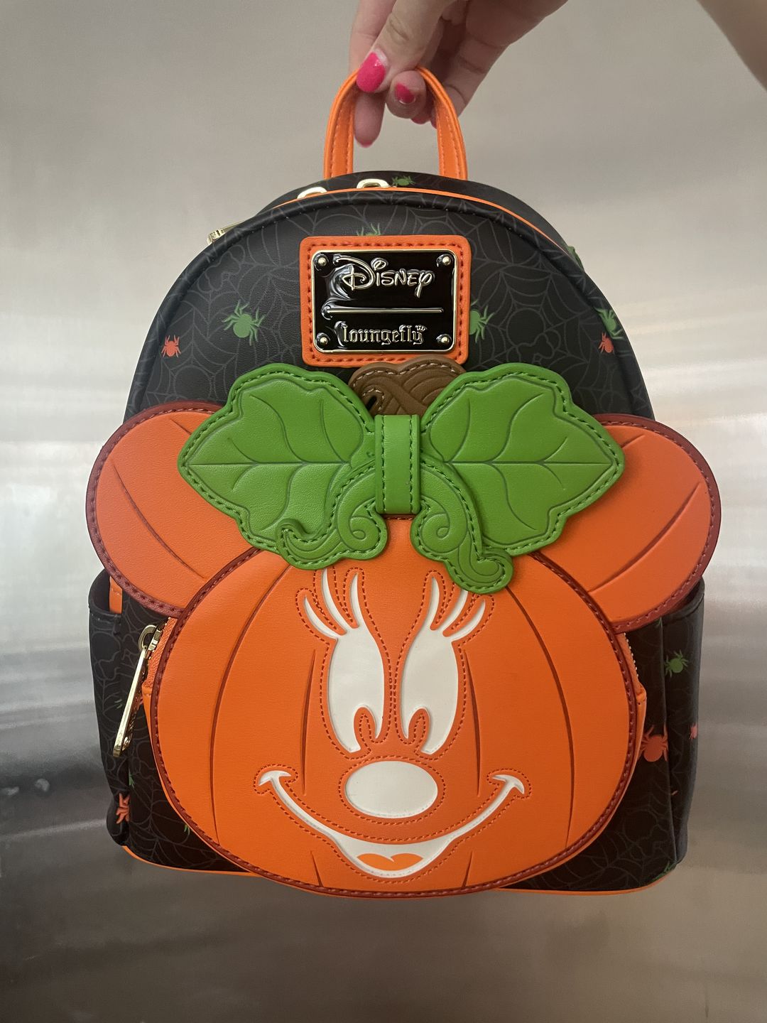 Customer photo review of 707 Street Exclusive - Loungefly Disney Glow in the Dark Pumpkin Minnie Mouse Mini Backpack