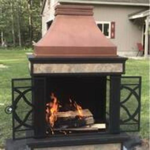 Customer photo review of Sunjoy Outdoor 57 in. Steel Wood Burning Fireplace with Fire Poker and Rain Cover