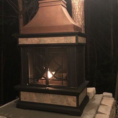 Customer photo review of Sunjoy Outdoor 57 in. Steel Wood Burning Fireplace with Fire Poker and Rain Cover