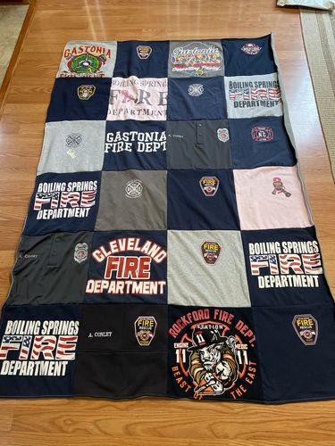 T-shirt quilt with firefighting, community service themes by Ashley from NC