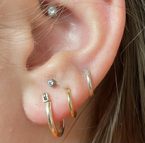 Customer photo review of 14k mini infinity hoops (10mm)