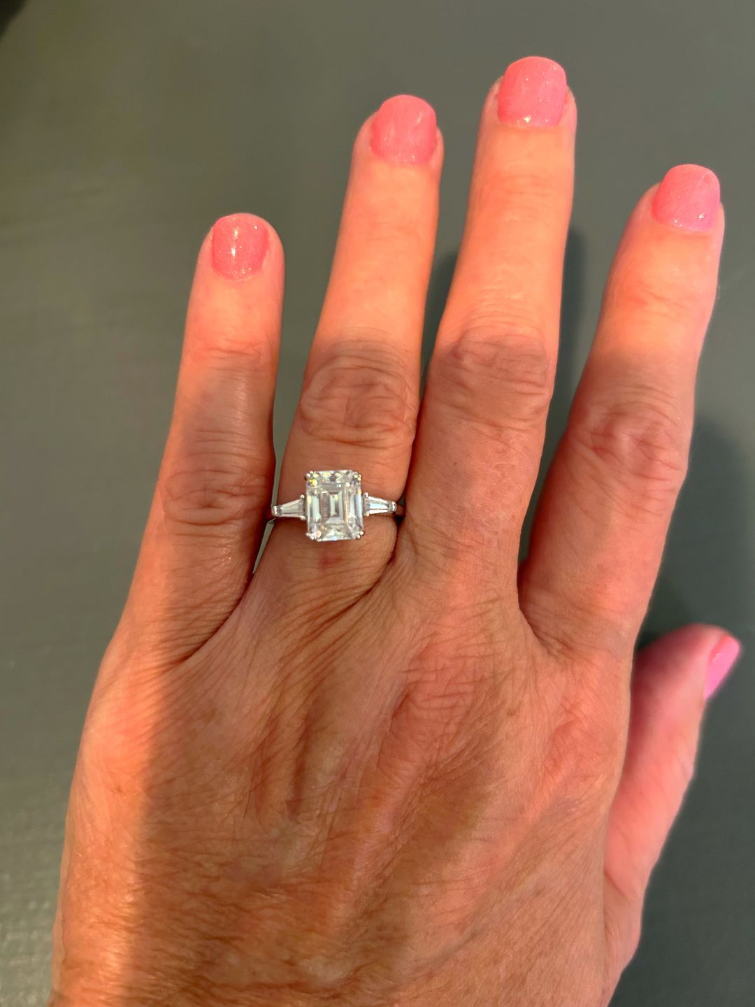 Customer photo review of Three Stone Emerald Cut Moissanite Tapered Baguette Engagement Ring