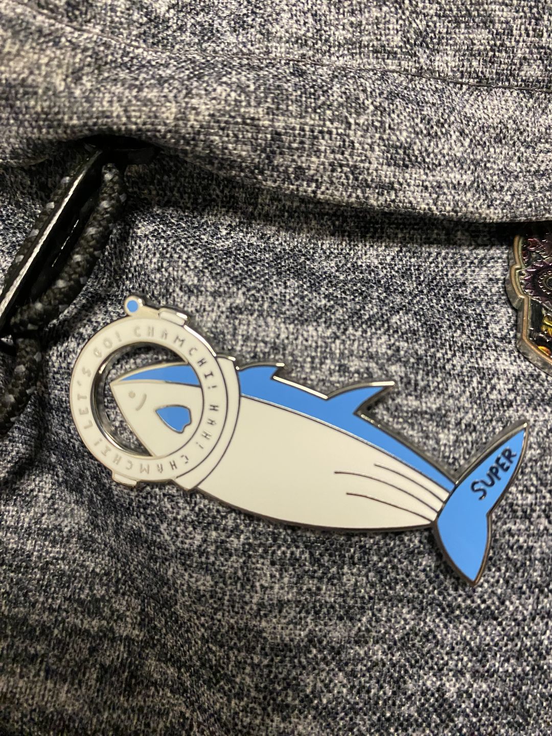 Customer photo review of BTS Jin Super Tuna x The Astronaut Enamel Pins