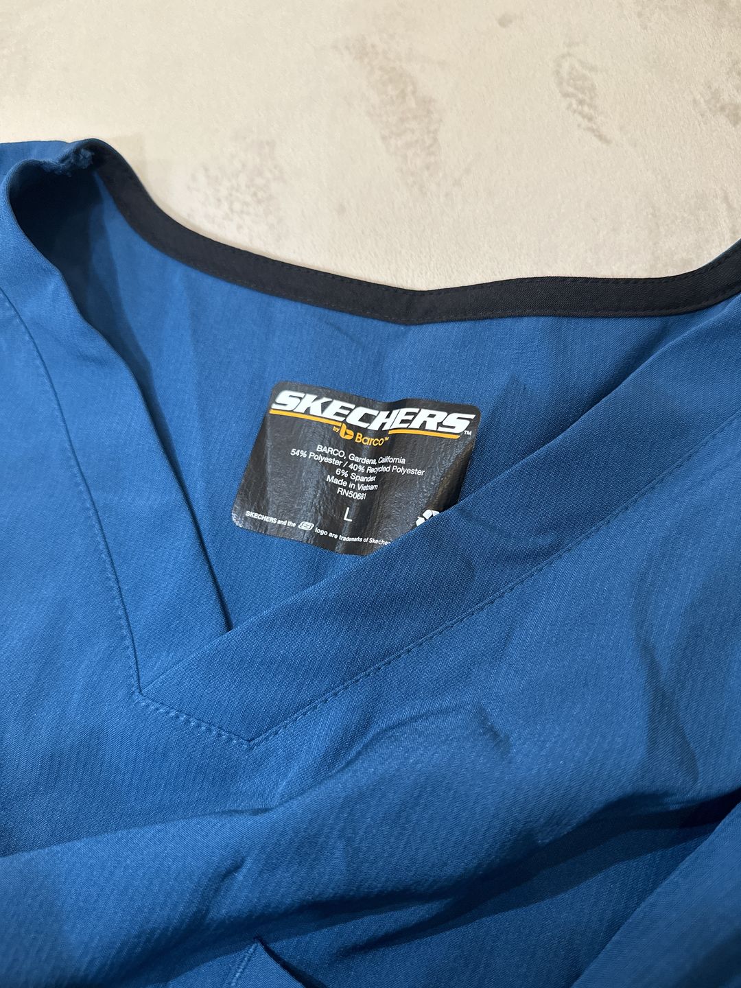 Customer photo review of بلوزة سكتشرز جيب واحد ~One pocket Scrub Top