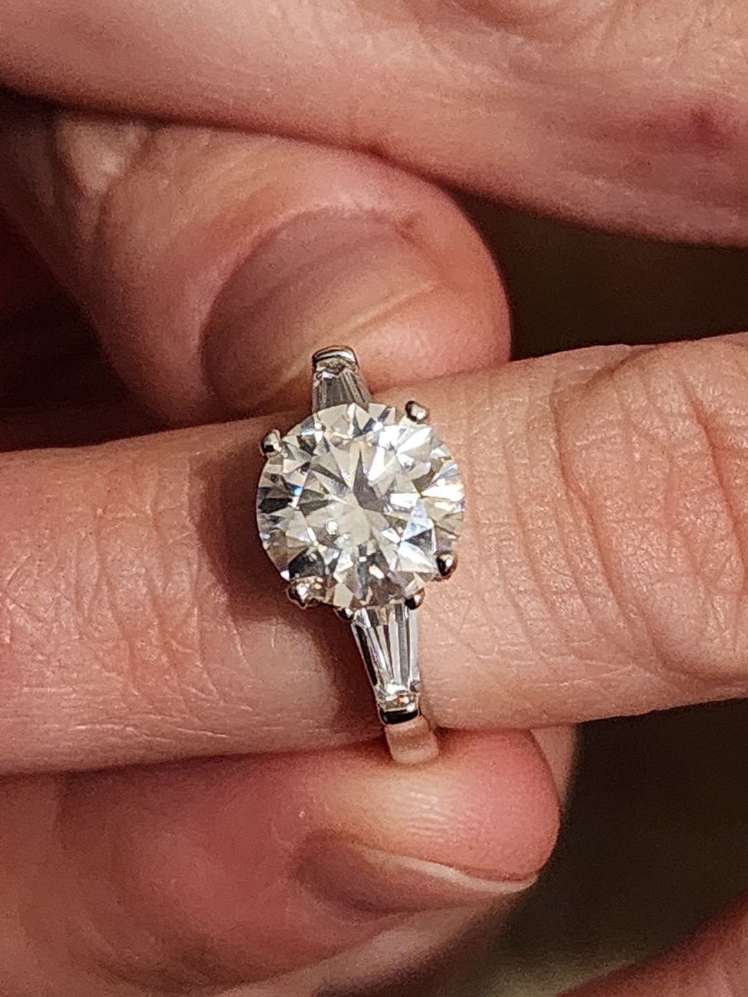 Customer photo review of Three Stone Round Moissanite Tapered Baguette Engagement Ring