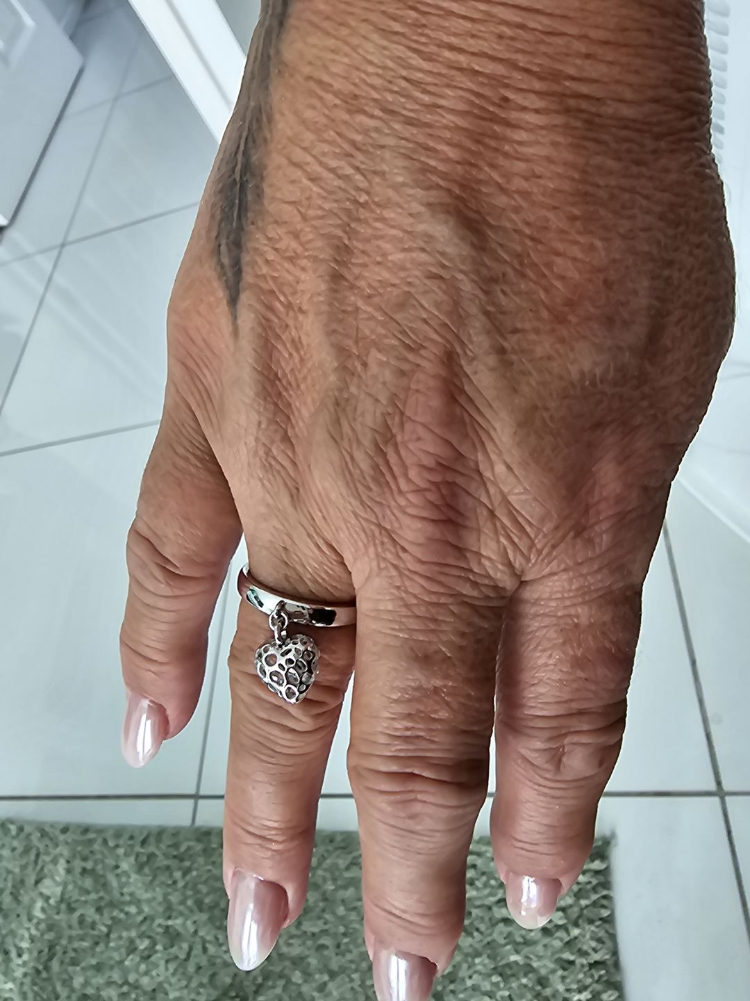 Customer photo review of Angel Heart Charm Ring with Tanzanite