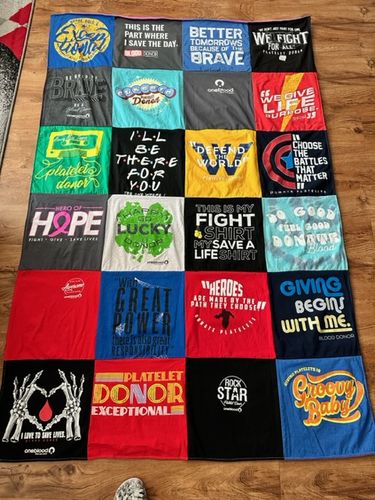 T-shirt quilt with health, donation themes by Dorinda from FL