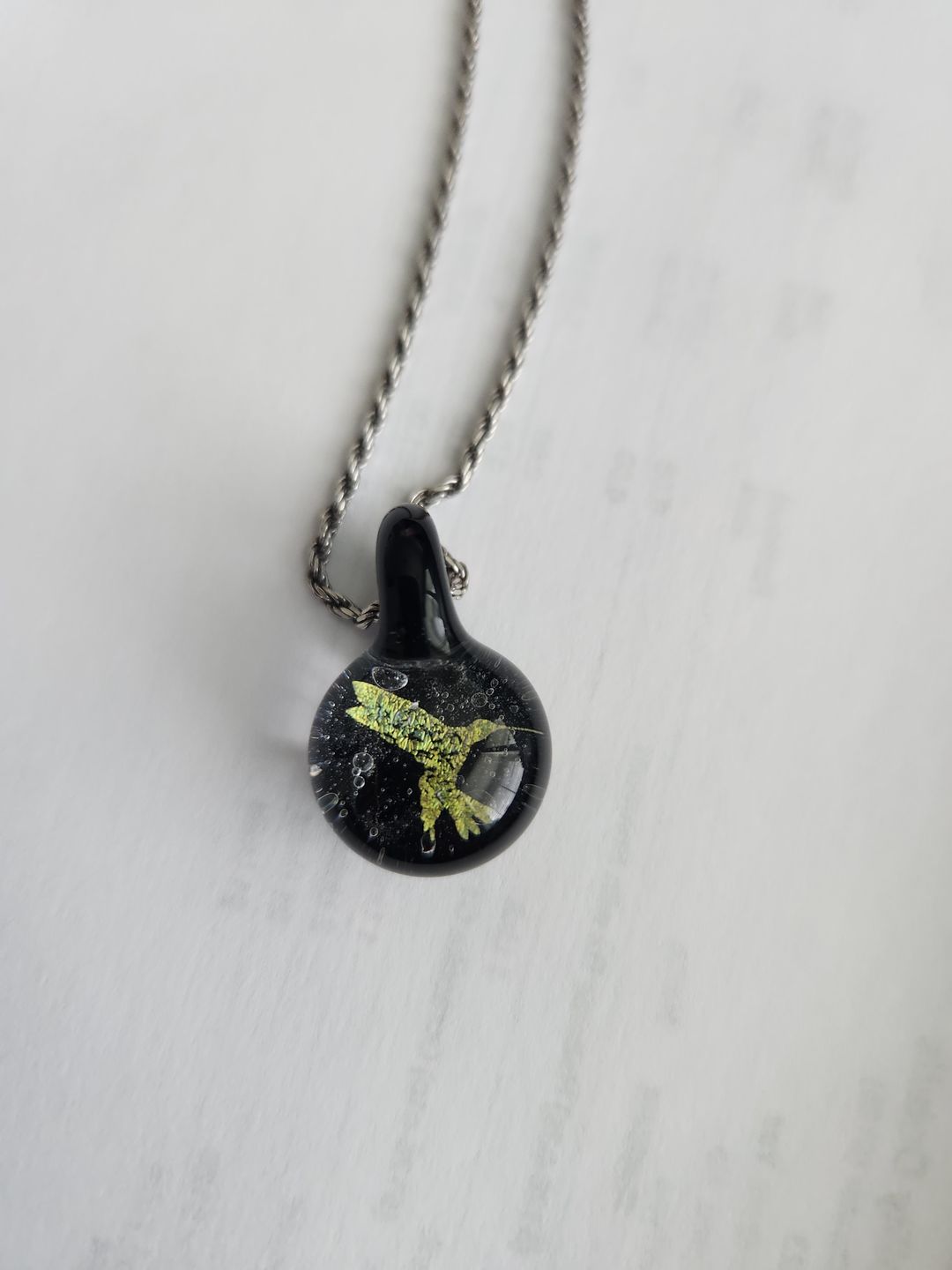 Customer photo review of Hummingbird Hologram Pendant with Infused Cremation Ash
