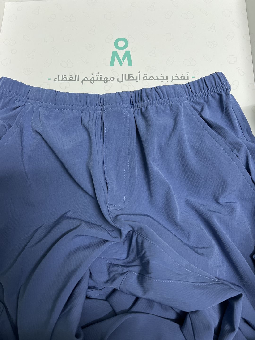Customer photo review of بلوزة سكتشرز جيب واحد ~One pocket Scrub Top
