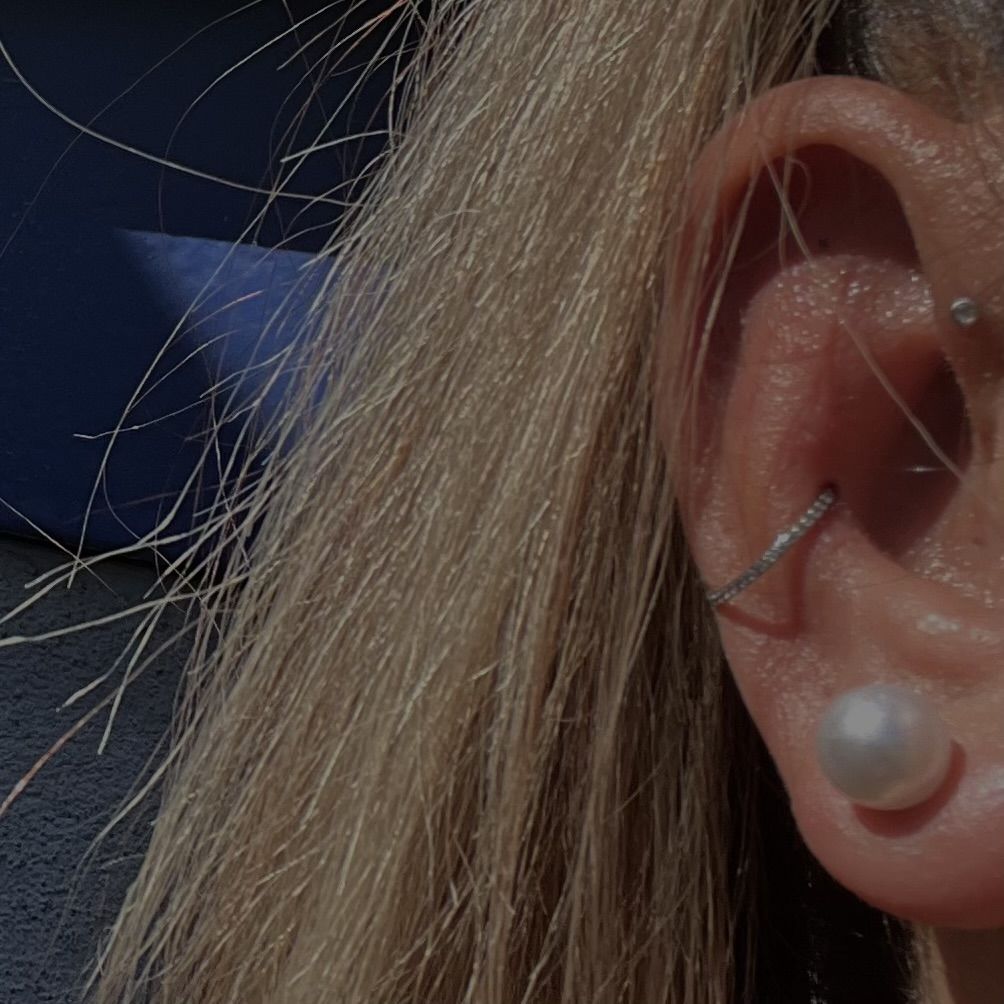 Customer photo review of Conch Clicker | Titan Piercing