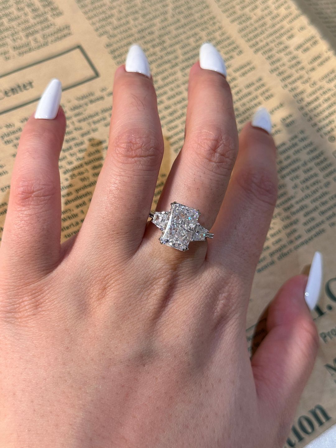 Customer photo review of Louily Gorgeous Three Stone Crushed Ice Radiant Cut Engagement Ring