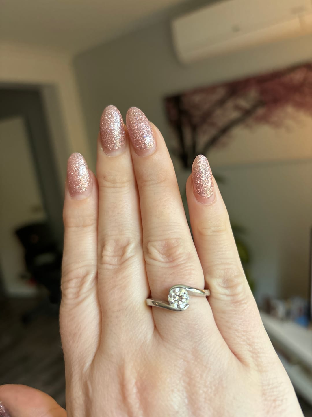 Customer photo review of Solitaire Tension Set Moissanite Bypass Engagement Ring