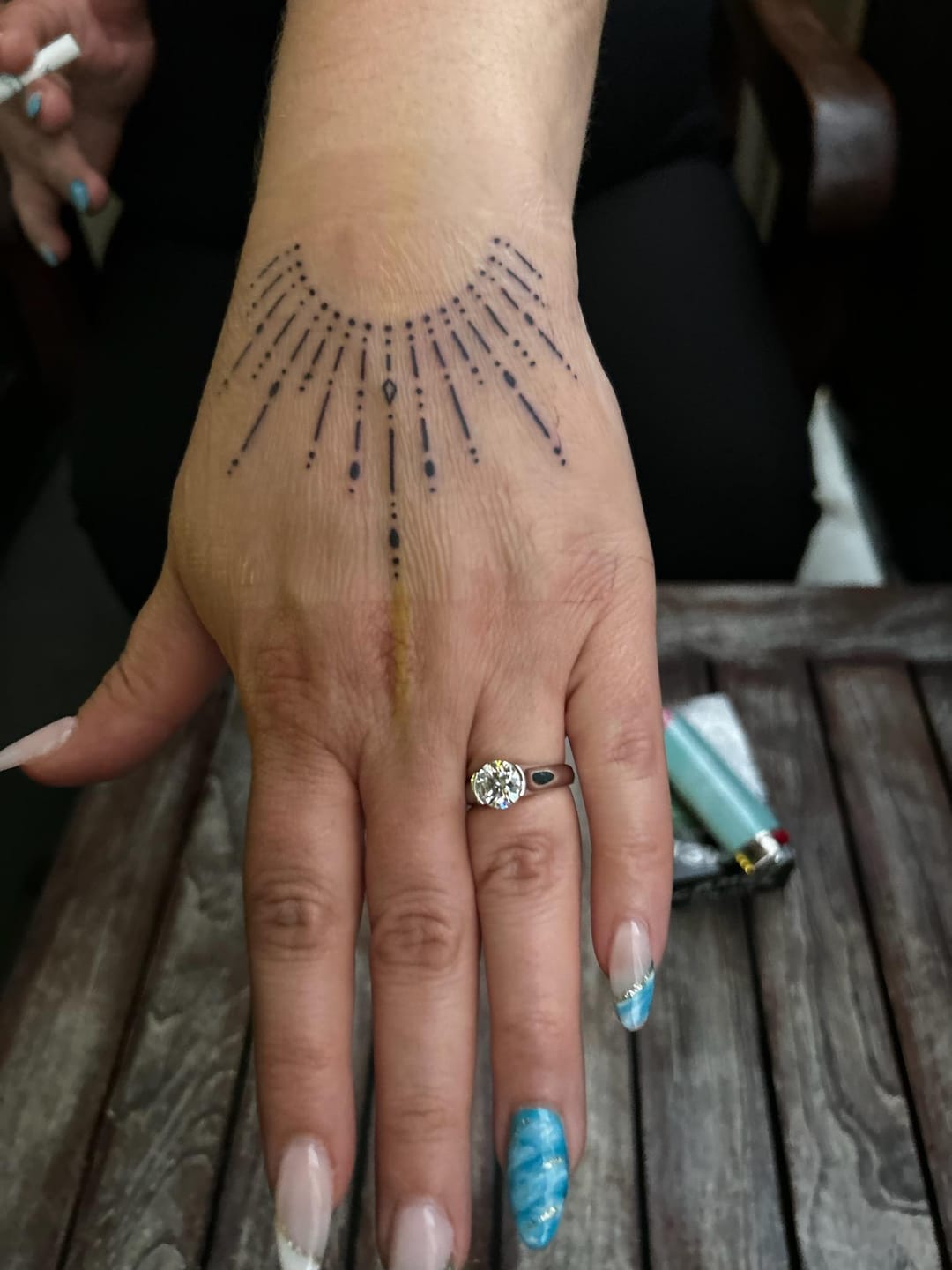 Customer photo review of Solitaire Moissanite Half Bezel Set Sterling Silver Engagement Ring