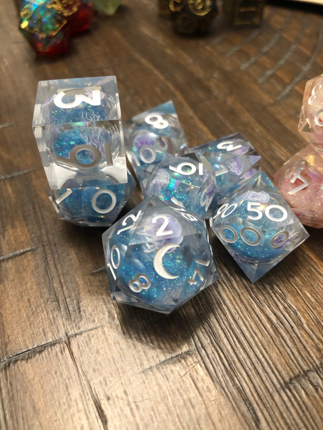 Customer photo review of URWizards D&D Glow in the Dark Liquid Core Resin Engraved Dice Set Jellyfish