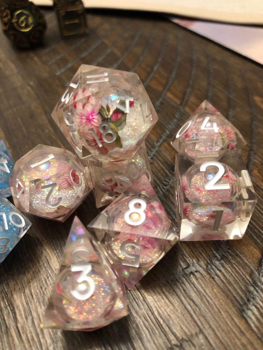 Customer photo review of URWizards D&D Liquid Core Resin Engraved Dice Set Sakura