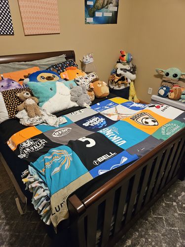 T-shirt quilt with stuffed animals, gaming themes by Brittany  from MI