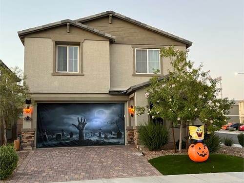 Customer photo review of Zombie Hand Rising Out Of A Graveyard In Spooky Night Garage Door Cover