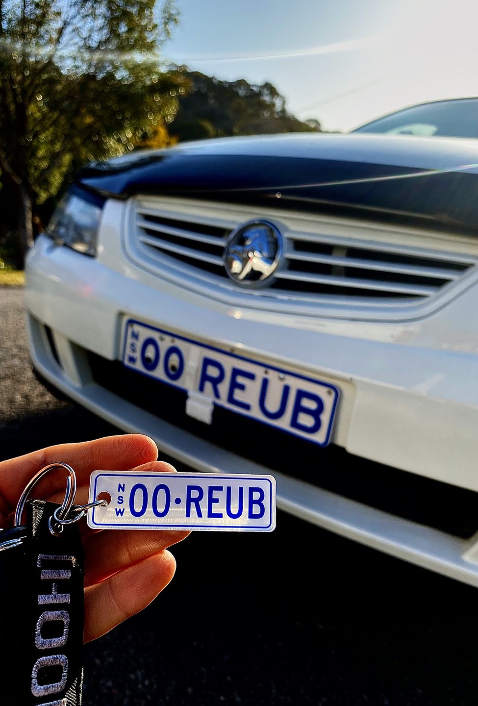 Customer photo review of NSW Colour on White Licence Plate Custom Keychain