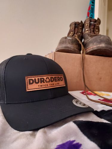 Customer photo review of Low Profile Embossed Leather Logo Trucker Hat Black