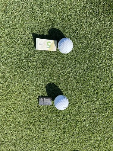 Customer photo review of Gold Drip Credit Card Ball Marker - Titanium