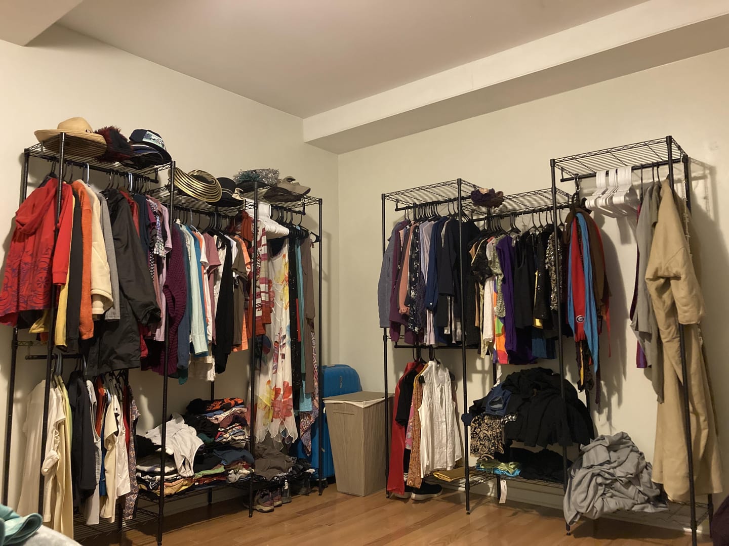 Customer photo review of Raybee 830lbs Portable Clothes Rack Heavy Duty, Freestanding Wire Clothing Rack with 4 Hanging Rods & Shelves, Adjustable Closet Wardrobe Organizer for Bedroom,Black/White