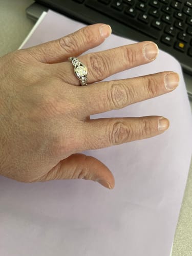 Customer photo review of Bezel Set Round Moissanite Scroll Accents Engagement Ring