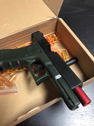 Customer photo review of Glock Auto Shell Ejection Blowback Laser Toy Gun